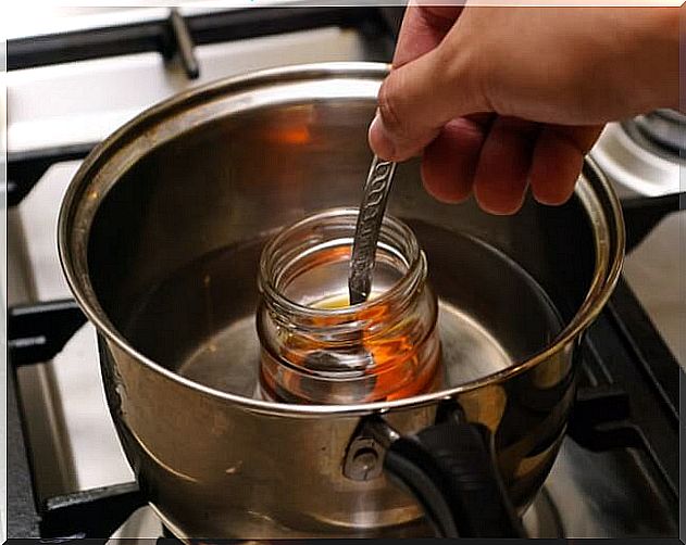 Jar of honey in a pot