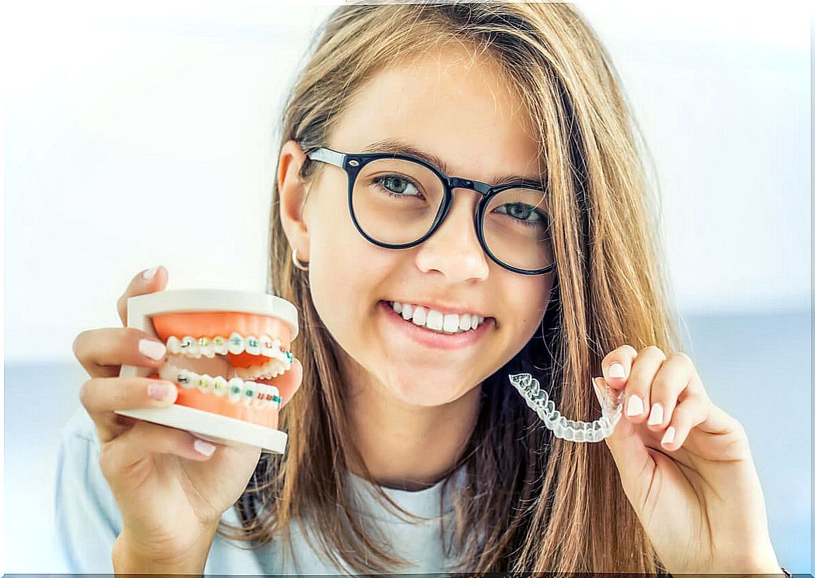 Young man with removable orthodontics that you must take care of