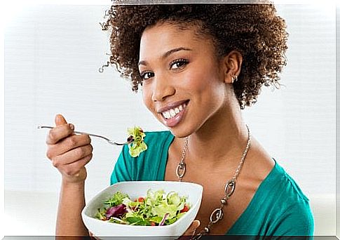 Woman eating salad