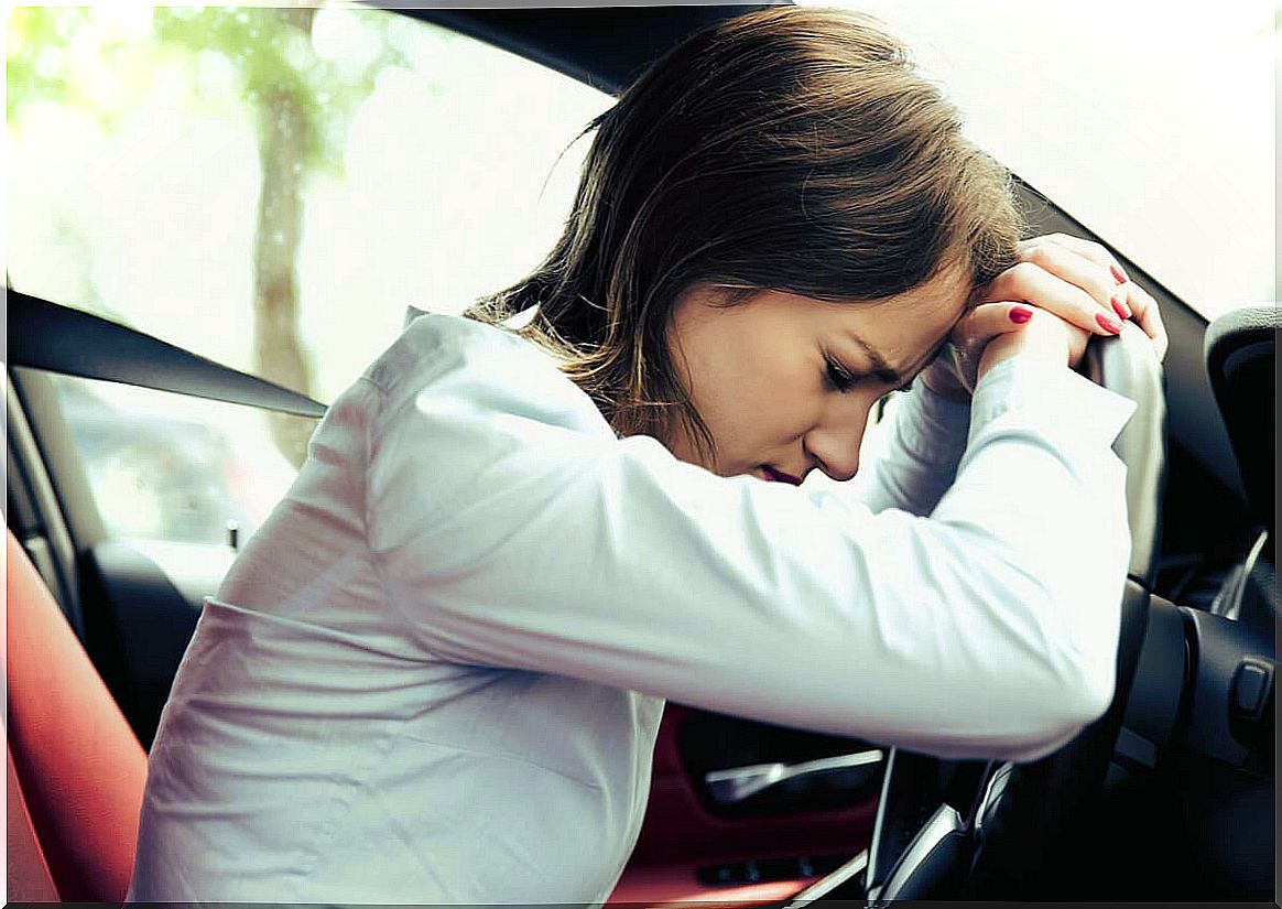 Stressed woman in the vehicle.