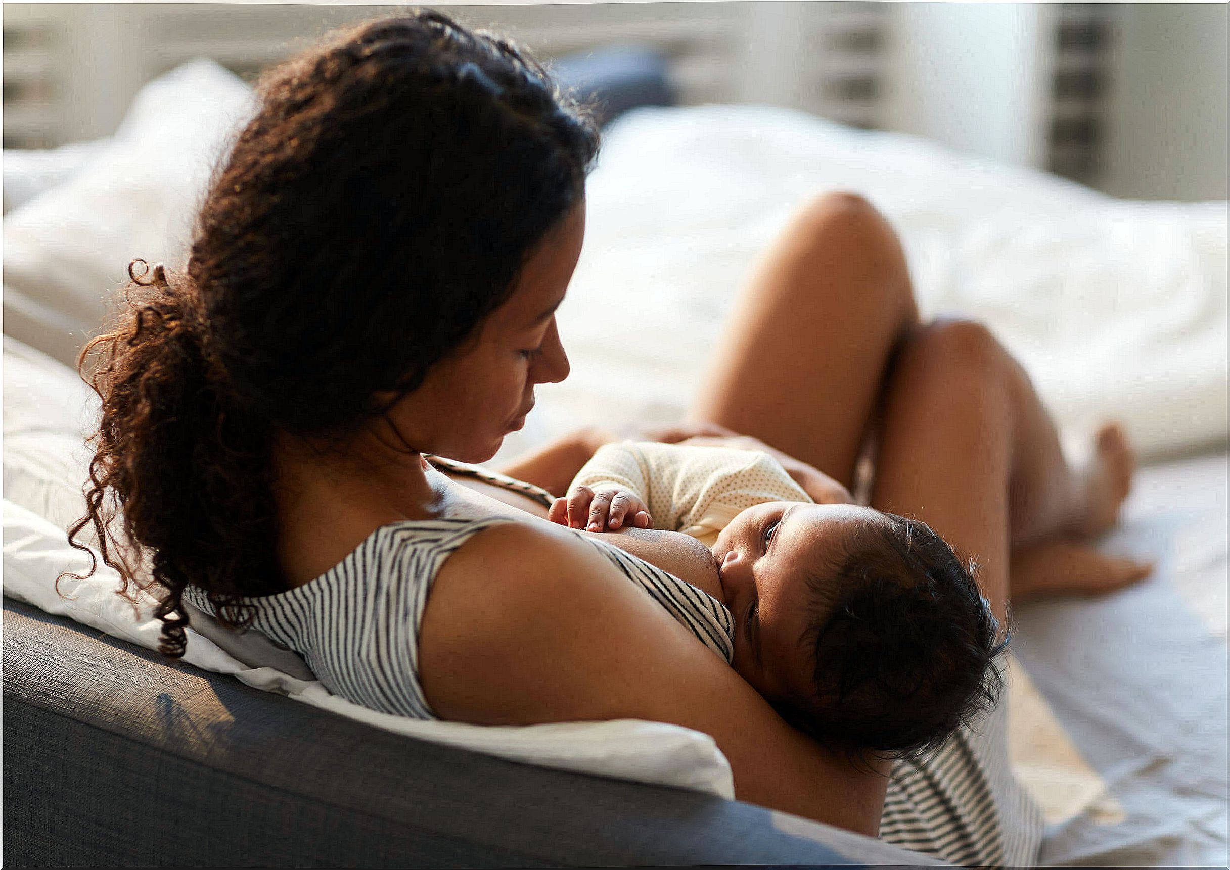 Mother breastfeeding her child.