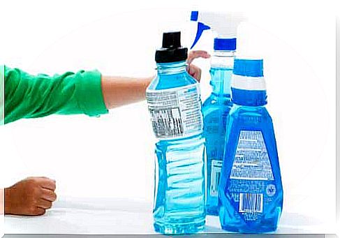 Child holding bottles of bleach